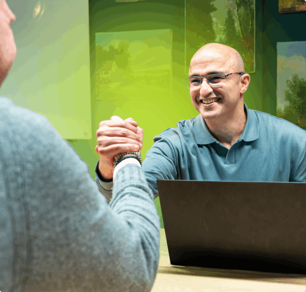 Two professionals shaking hands - Momentum partnership in action