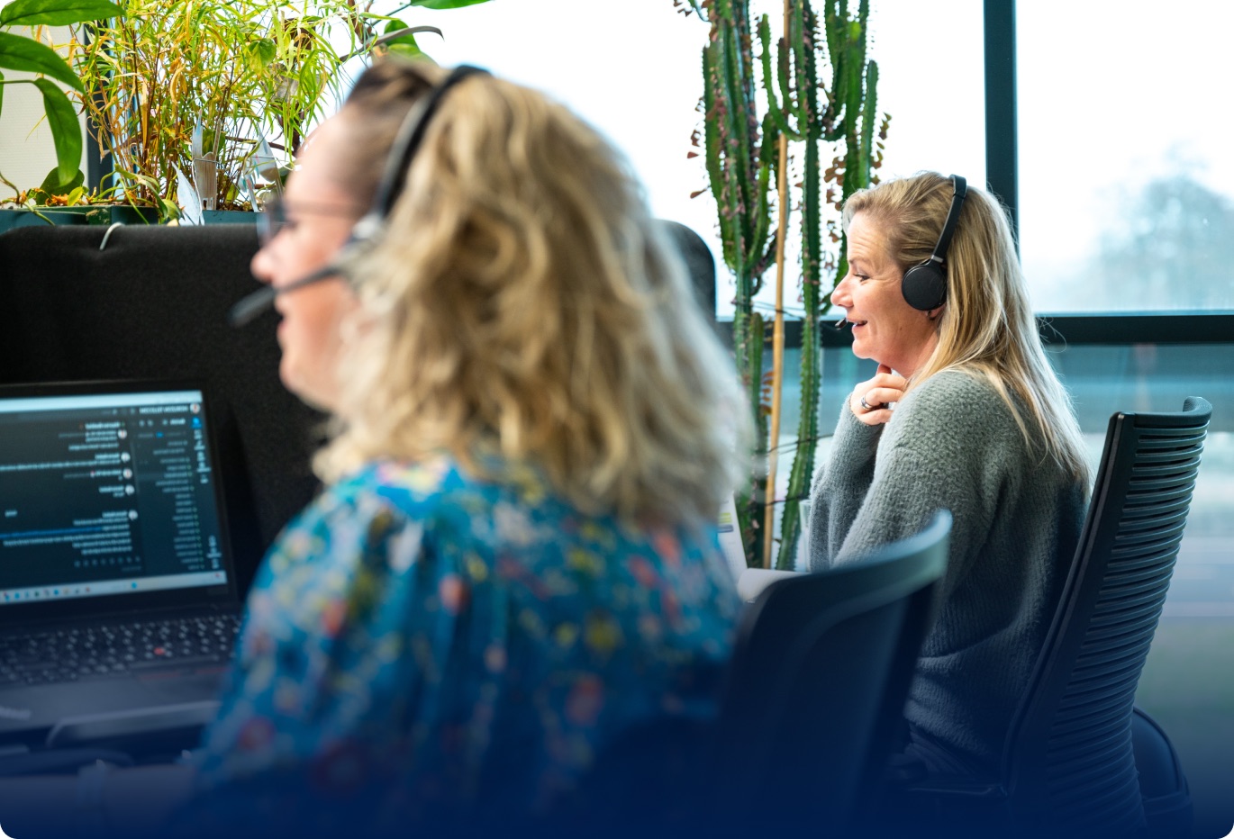 Momentum customer service team with headsets - personal commitment behind every connection