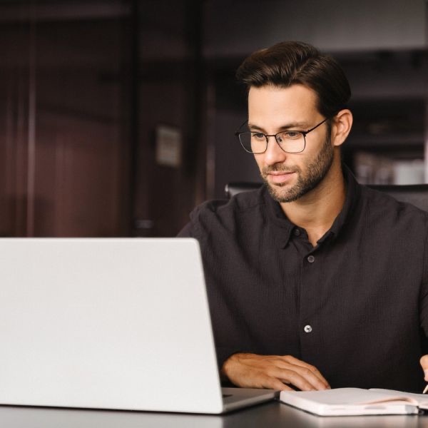Focused professional at laptop - Cato Networks cloud-native SASE platform
