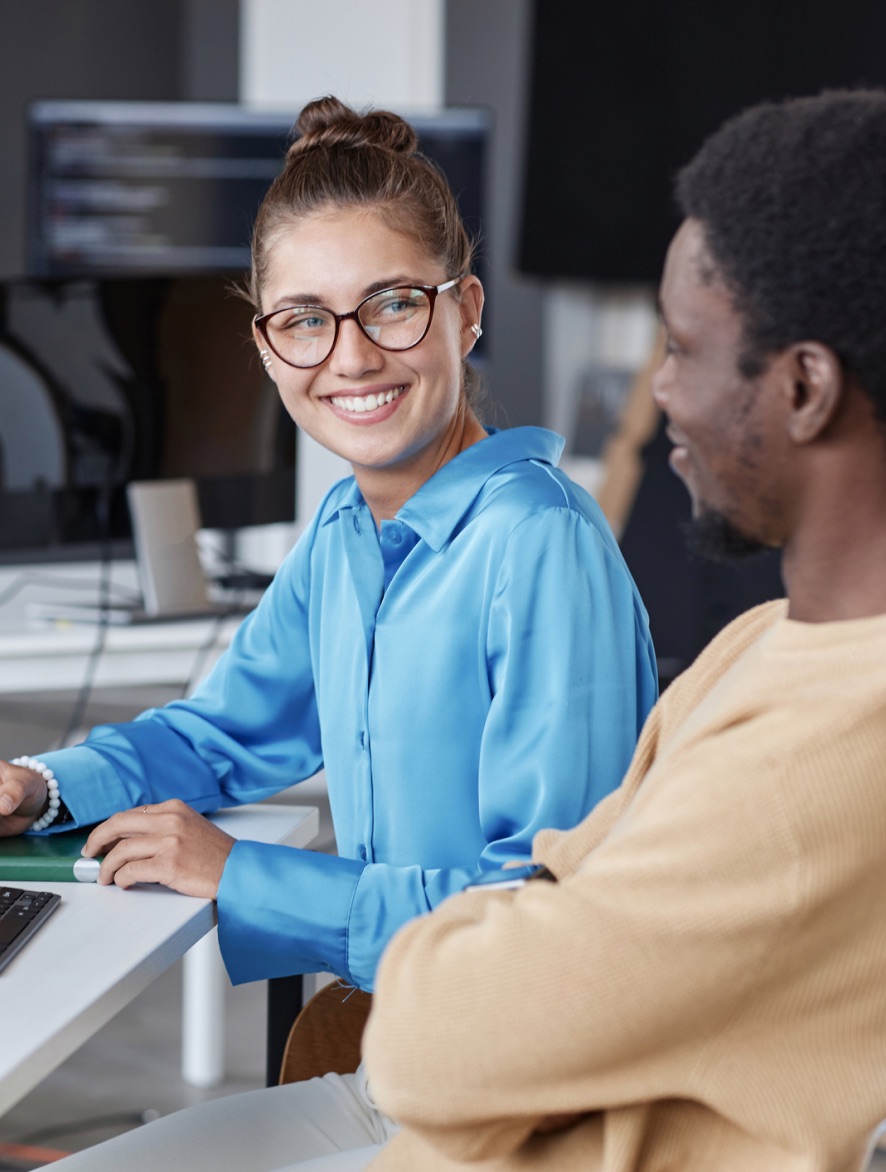 Smiling professional with smartphone and laptop - Teams Faxing secure cloud fax