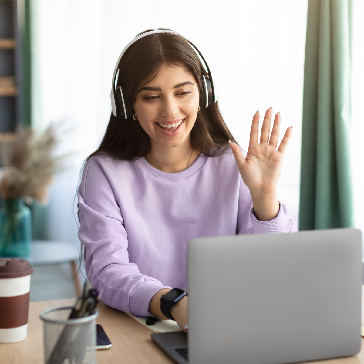Smiling professional with smartphone - Teams Phone cloud calling and routing