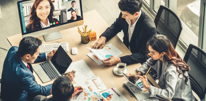 Microsoft Teams conference call with 4 business people in a meeting