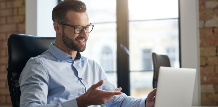 Man with beard speaking on a conference call with Microsoft Teams