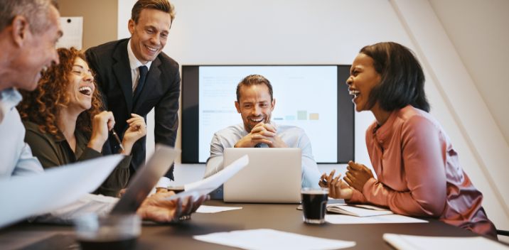 a team meeting in a conference room with cloud communications