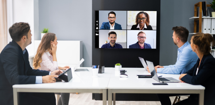 a conference room with a Microsoft Teams meeting