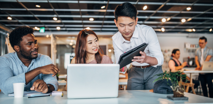 people looking at sd-wan reports on tablet